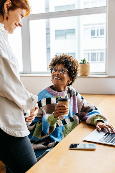 Freelance colleagues interacting in a bright co-working space