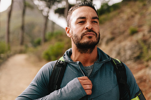 Young male runner on country road