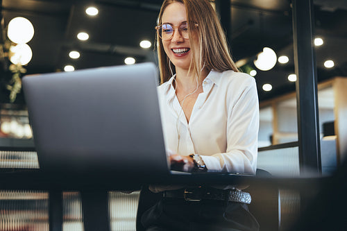 Female entrepreneur taking a video call in an office