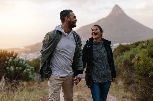Young couple walking together in countryside