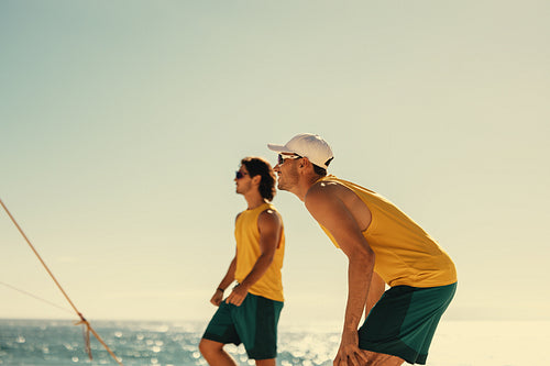 Pro volleyball players at sunset: Brazilian team competes in coastal championship