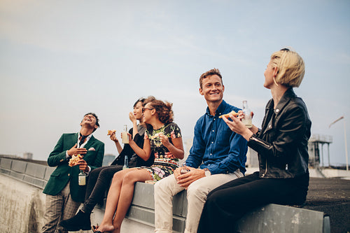 Group of young friends partying on terrace