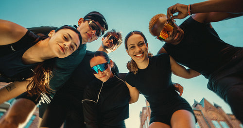 Running club friends gather for an energetic post-run photo outdoors