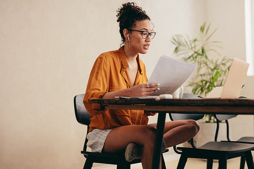 Woman on a video call with colleagues from home