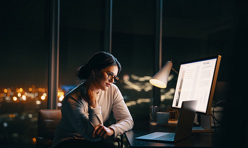 Business woman having a nighttime virtual meeting in her office