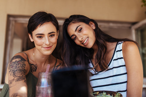 Women taking selfie at a restaurant