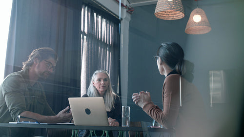 Business associates shaking hands after productive meeting