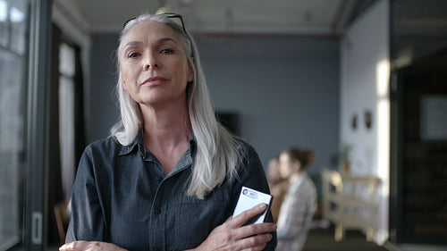 Senior businesswoman at standing office