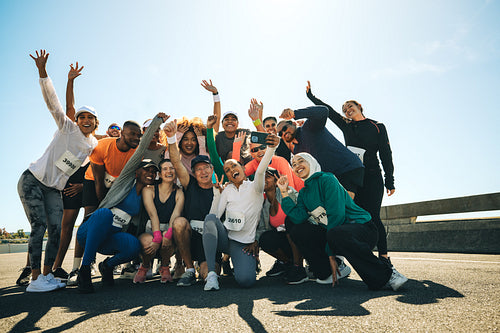 Running club group photo on an energetic race day