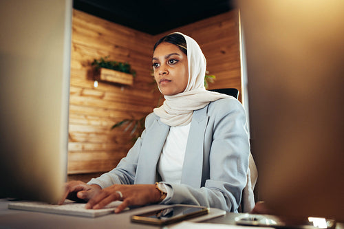 Young Muslim businesswoman working on a computer