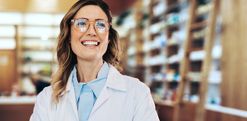 Healthcare worker standing in a pharmacy