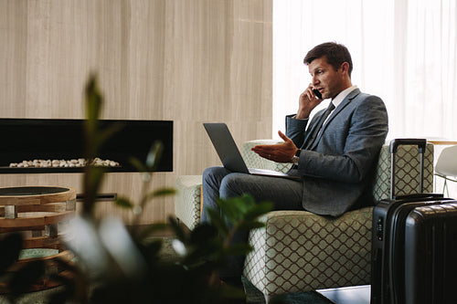 Entrepreneur working at waiting room in airport terminal