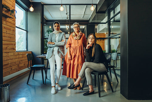 Multicultural businesswomen looking at the camera in an office