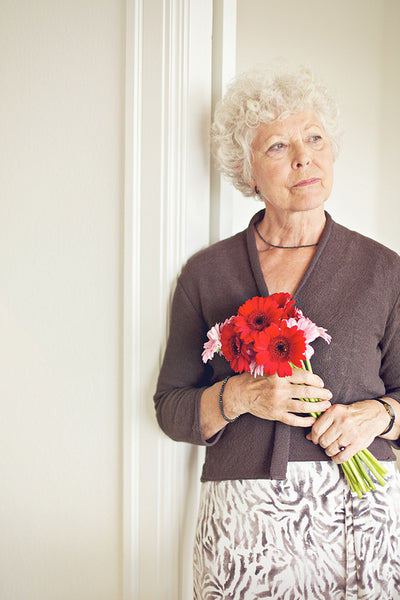 Mature Woman with Flowers Posing