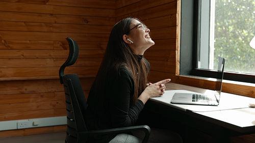 Female freelancer having a video call in a coworking space