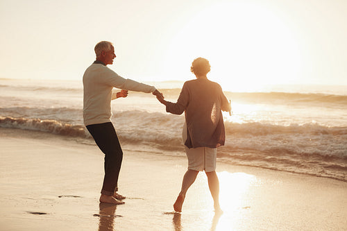 Senior couple having fun at beach