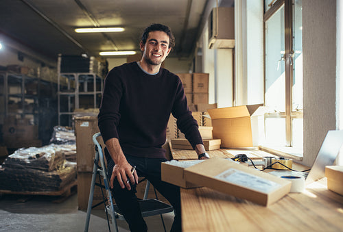 Small business owner at his work desk