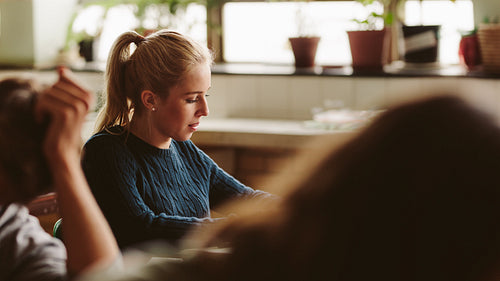 Teenage girl studying in college classroom