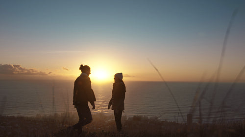 Romantic couple enjoying themselves on mountain peak