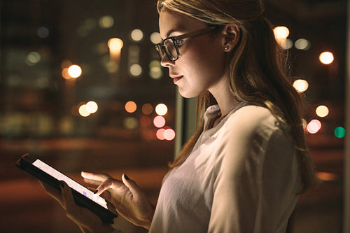 Businesswoman using a tablet computer at work