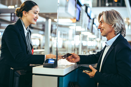 Businessman doing check in at airline check-in counter