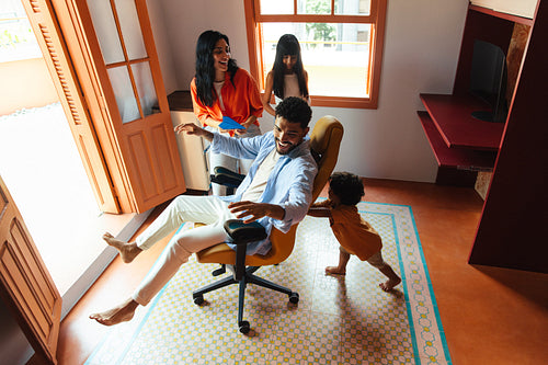 Happy family enjoying playful moments together indoors
