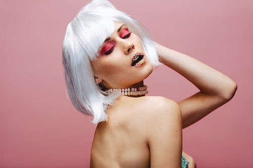 Sensual fashion model wearing artistic makeup