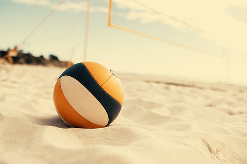 Coastal championship: Pro tour volleyball game on seashore sand court with skyscape background