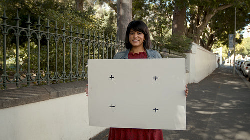Portrait of a happy woman with blank banner