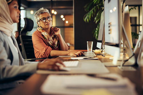 Business professionals having a discussion in an office