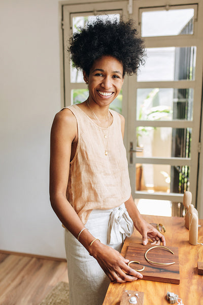 Owner with designed jewelry in studio