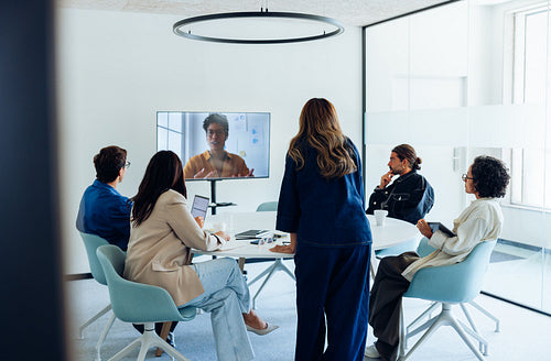 Team reviews design ideas during video conference