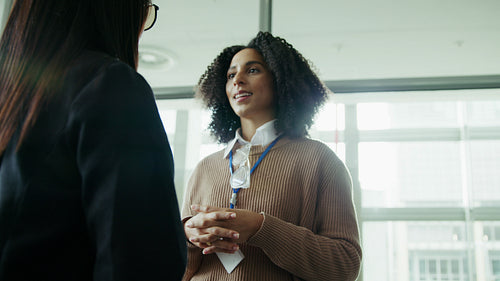 Professionals talking at a workplace