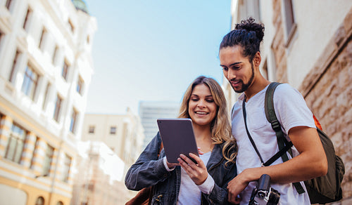 Tourist couple exploring the city 
