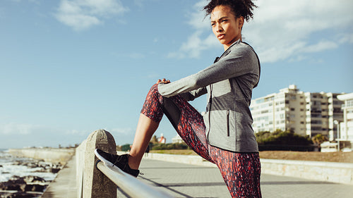 Runner doing leg stretches