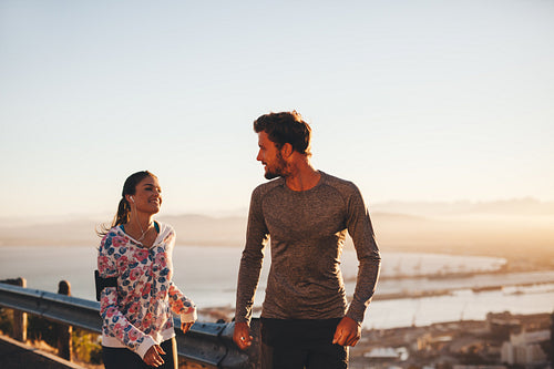 Fit young couple jogging outdoors