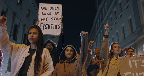 Group protesting with banners at night