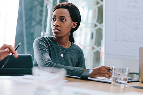 Young african woman in business meeting