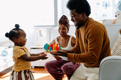 Family joy as parents play with child
