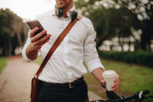 Close up of a businessman looking at his cell phone