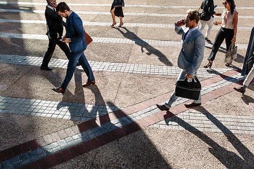 People walking to office in the morning on a busy street