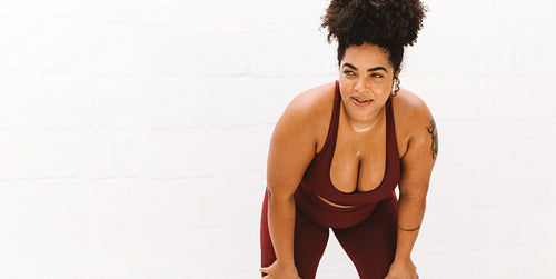 Tired plus size woman taking break