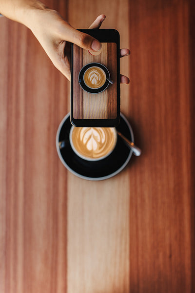 Woman sharing her coffee picture on social media