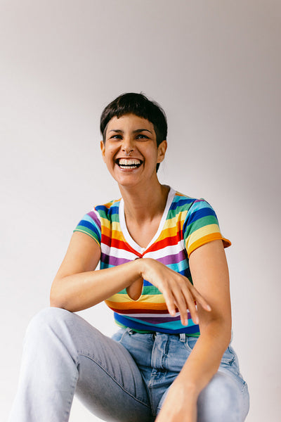 Lesbian woman laughing cheerfully during pride month