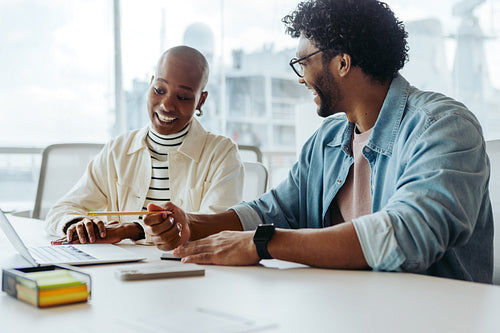 Successful business professionals collaborating and planning together in an office