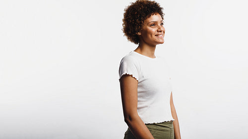 Happy young woman with curly hair