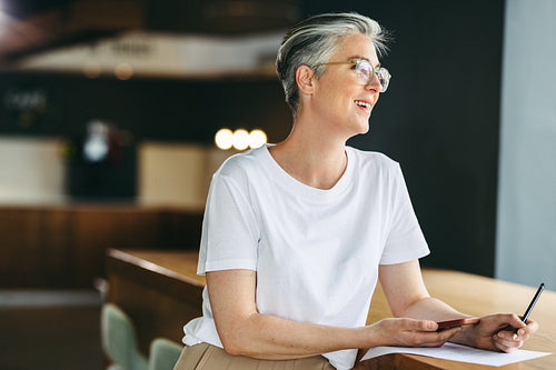 Pensive businesswoman working in a co-working space