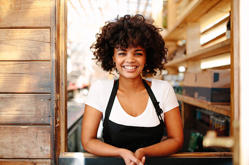 Portrait of female bartender in coffee shop