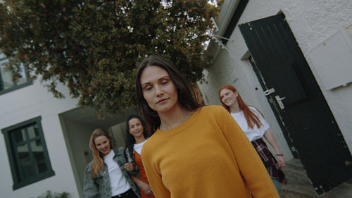 Woman with friends walking outdoors