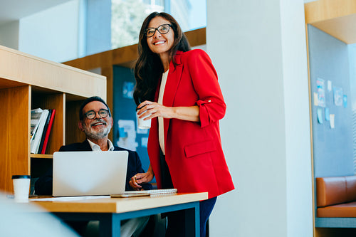 Senior executives engaging in discussion in a professional office setting